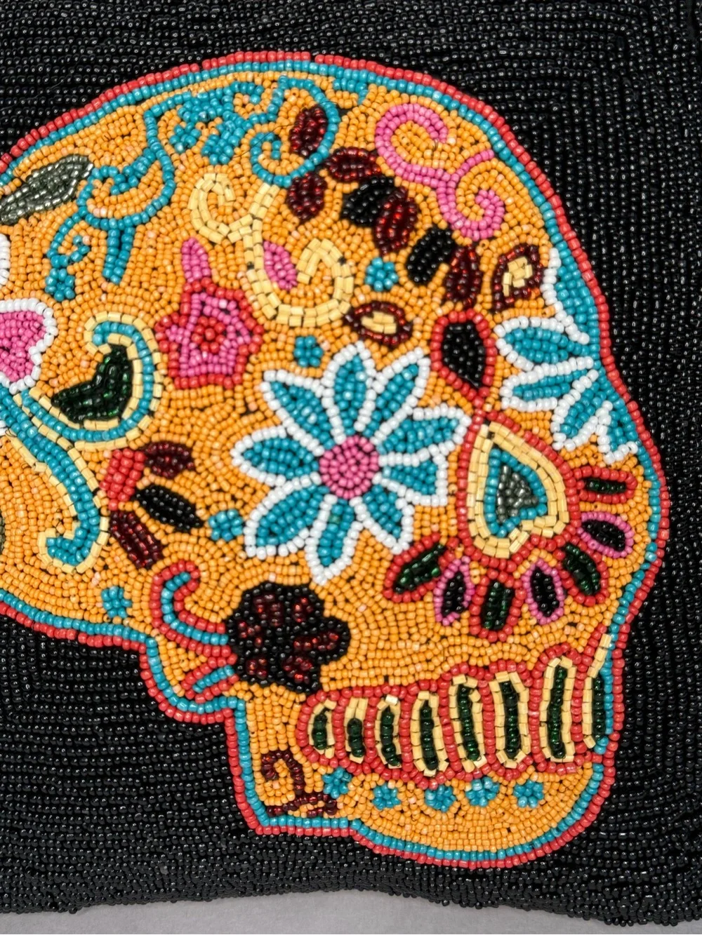 Black beaded 14” pillow with skull motif